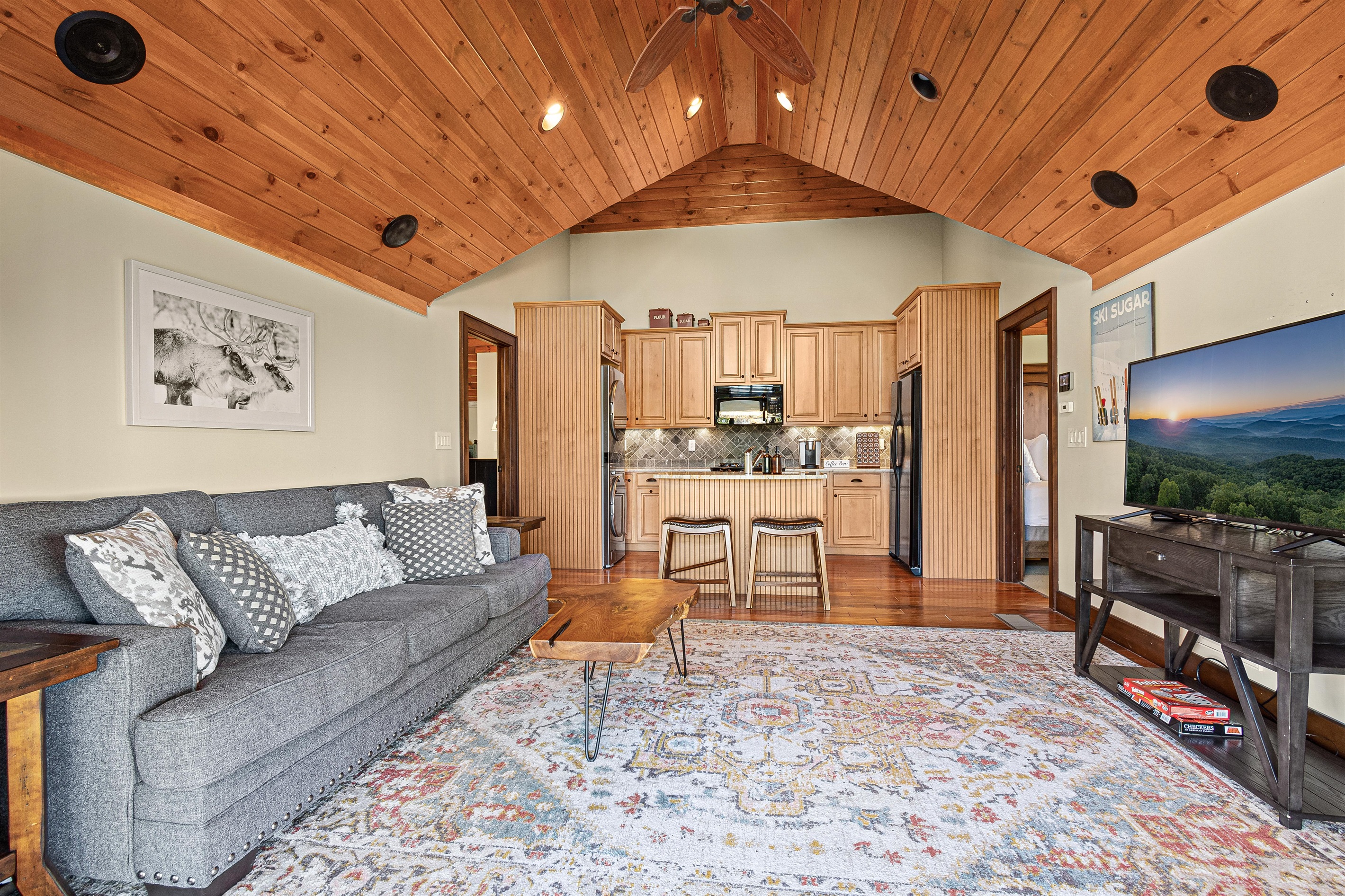 Guest House: Family room, 55" SmartTV, full kitchen, and  queen sized sleeper/sofa.