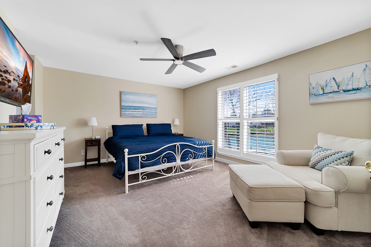 Master bedroom features king bed