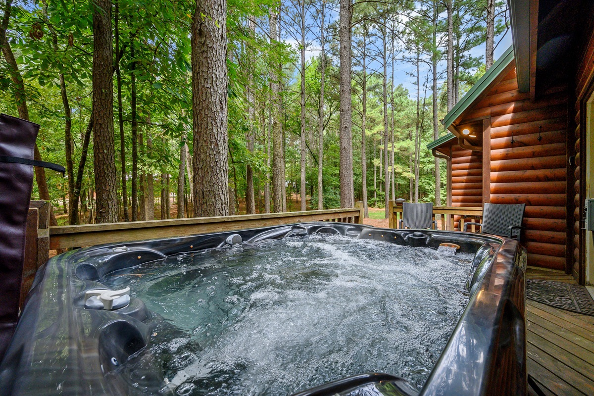 Hot tub sits off the media room with additional seating for morning coffee.