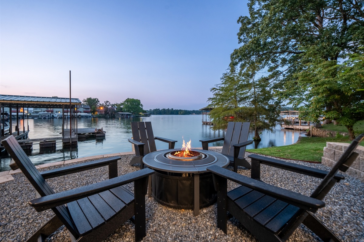 Relax and unwind by the fire pit, with beautiful waterfront views as your backdrop. This outdoor space is perfect for cozy evenings with loved ones.