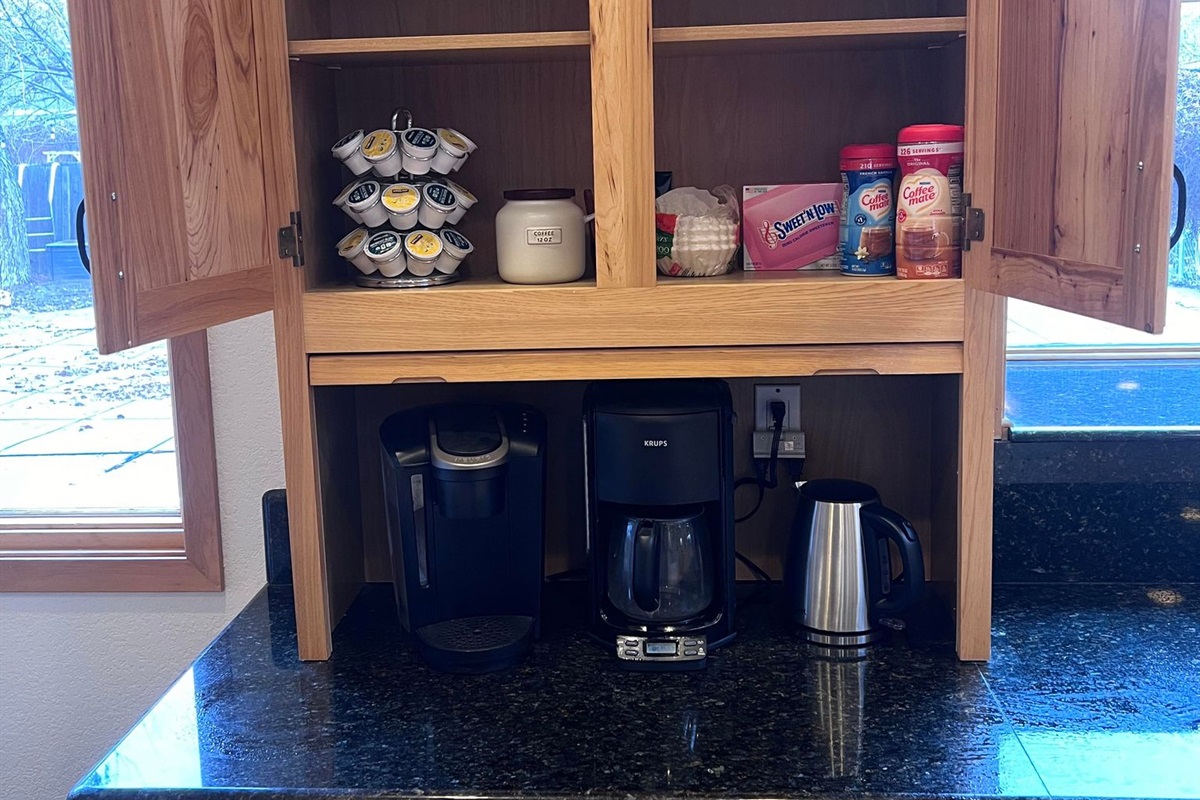 Full Coffee Station with  Kurig, coffee maker and stainless steel electric water kettle. Featuring coffee and tea for your stay.