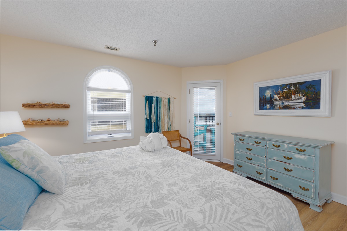Master bedroom featuring a coastal-themed decor
