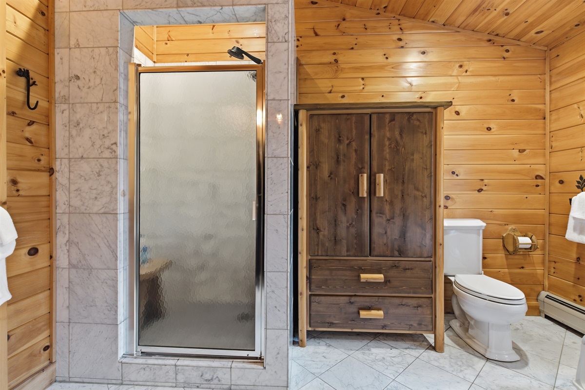 A relaxing ensuite designed for comfort after long days outdoors.