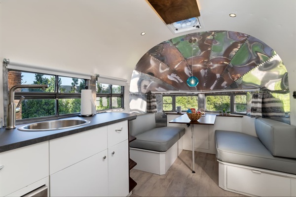 Kitchenette and leather dining booth for four