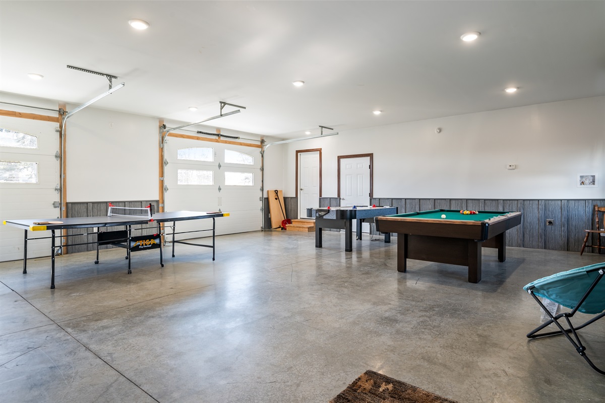 Massive game room designed for connection and fun—challenge friends to a match or kick back and unwind after exploring the lakes.