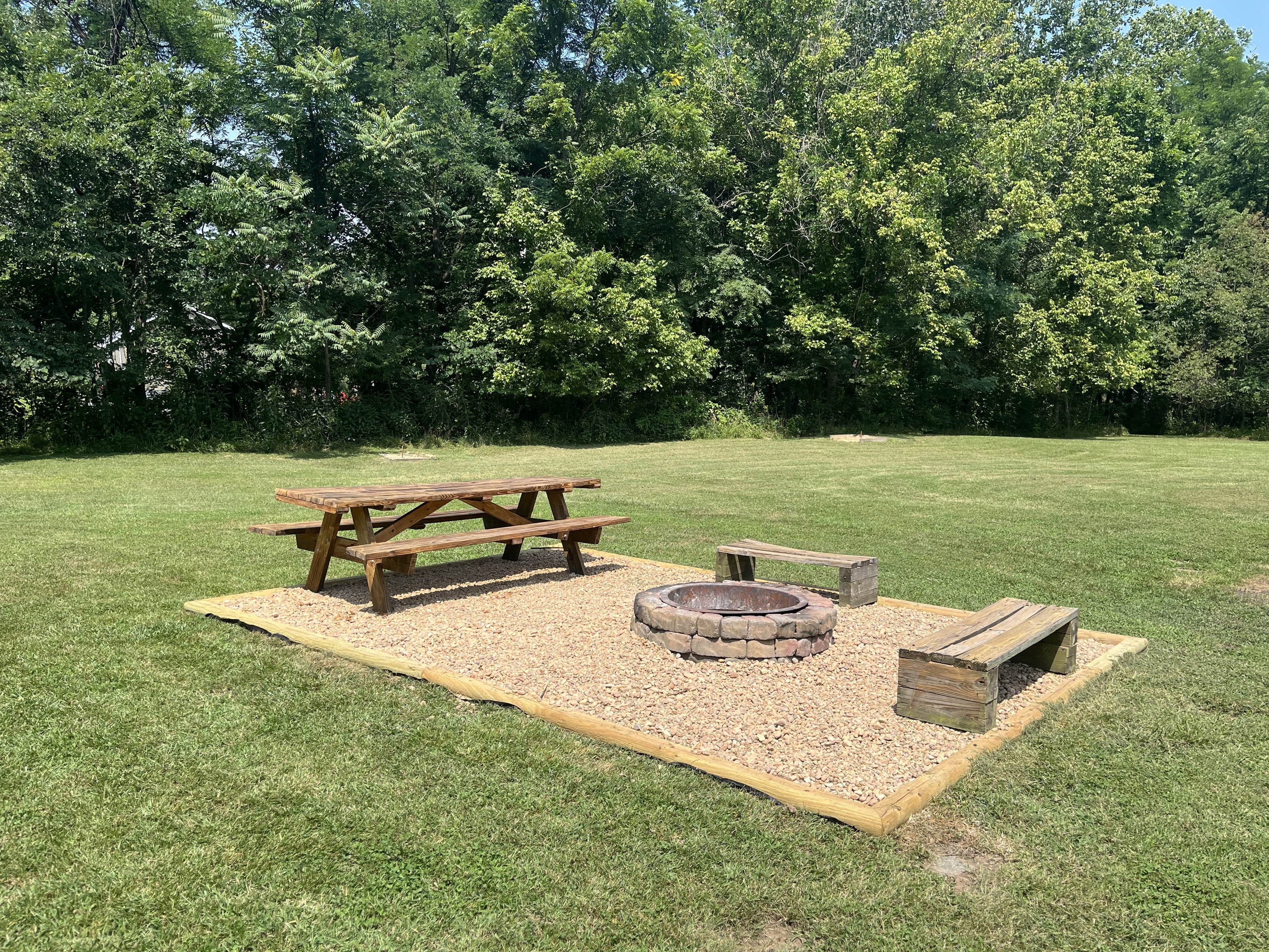 Newly added fire pit area with picnic table