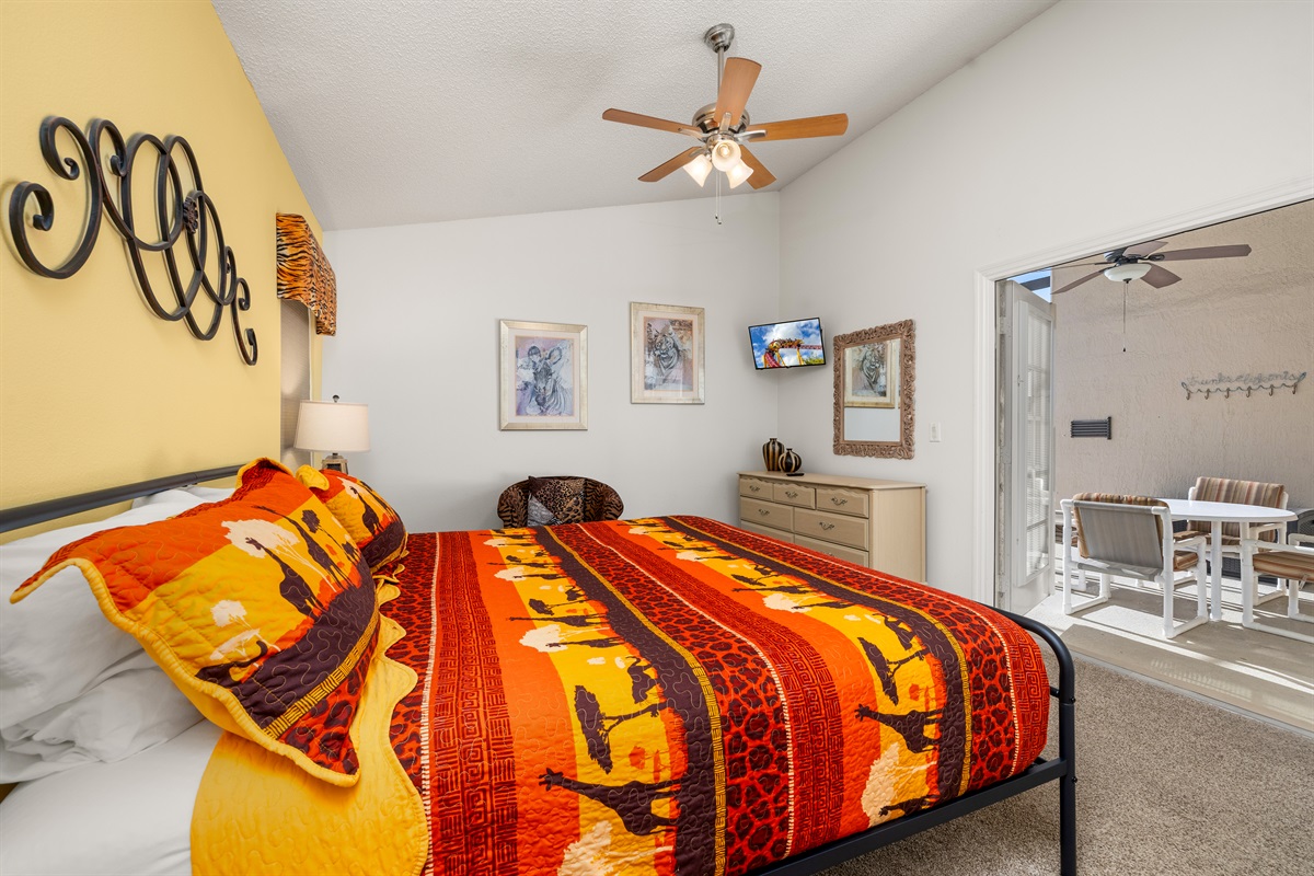 Enjoy the wall mounted TV and the french doors to the lanai in king suite.