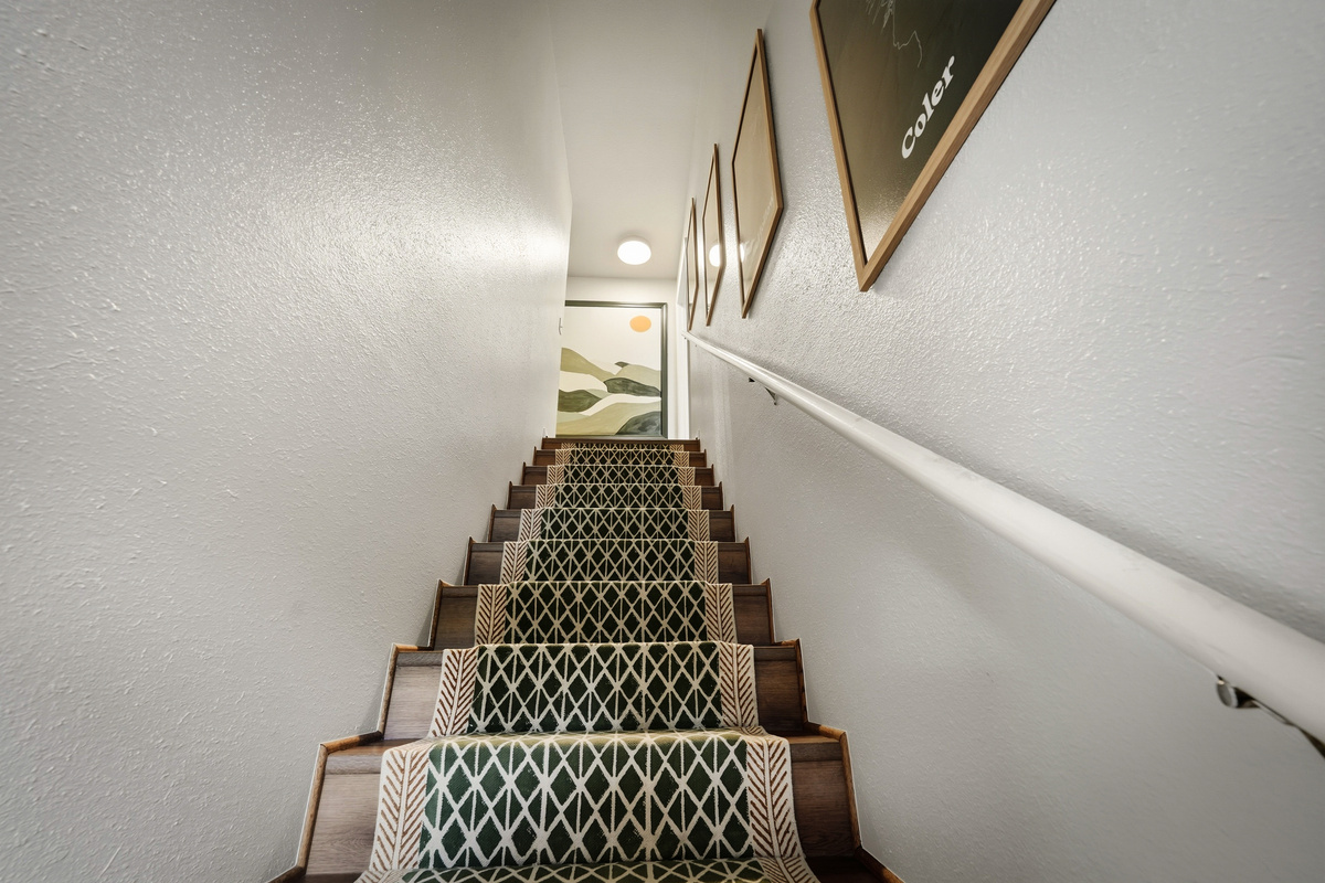 Staircase leads to bedrooms upstairs