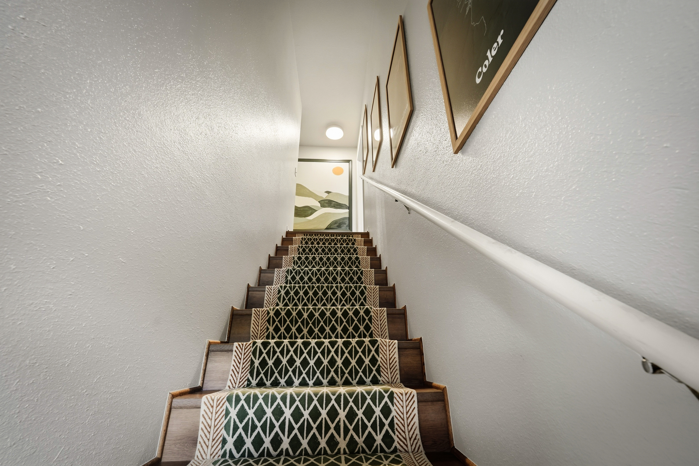 Staircase leads to bedrooms upstairs