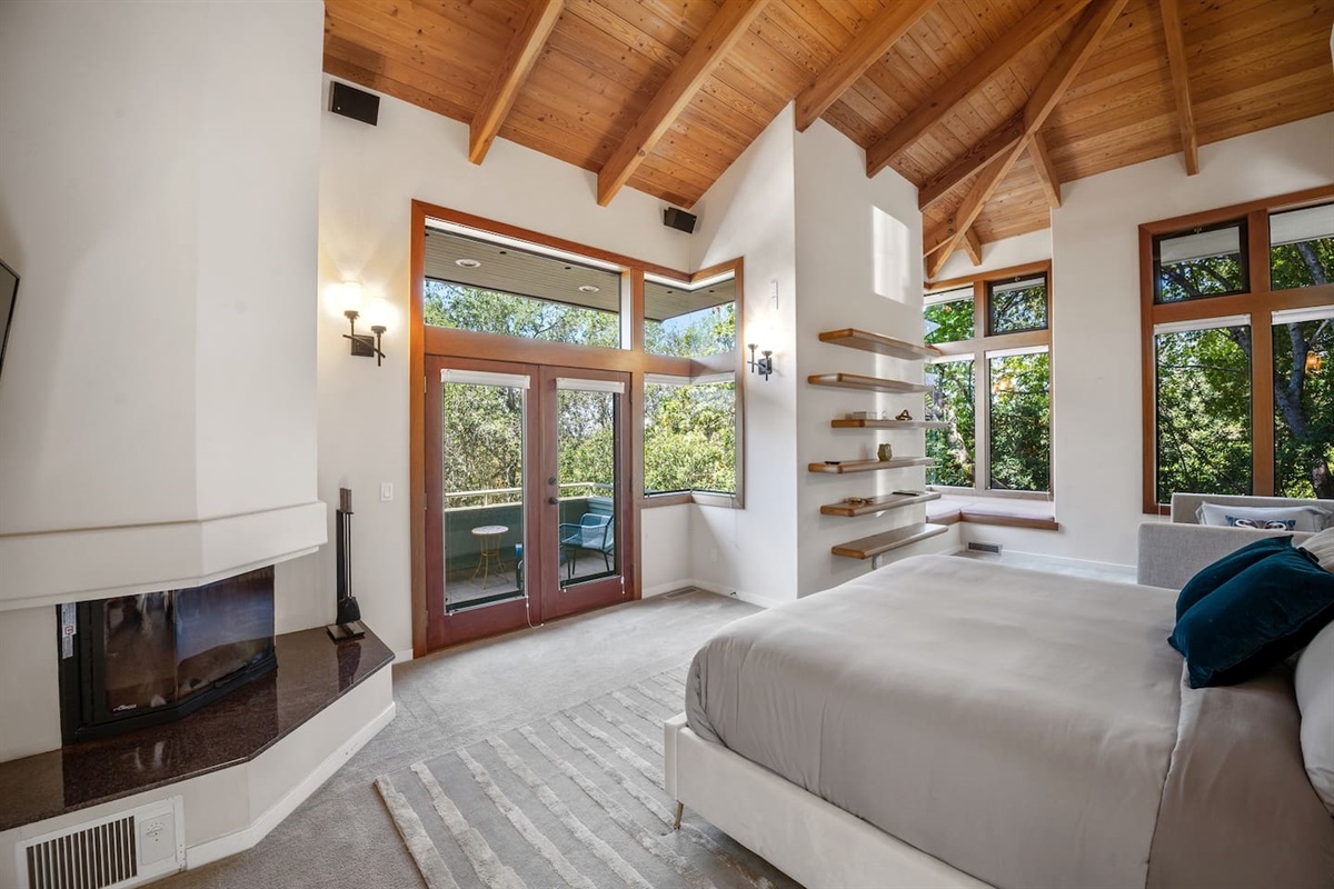 The primary suite is quite large, with a king bed, daybed (twin-sized with hideaway trundle twin), private balcony, window seat, and attached private bathroom.