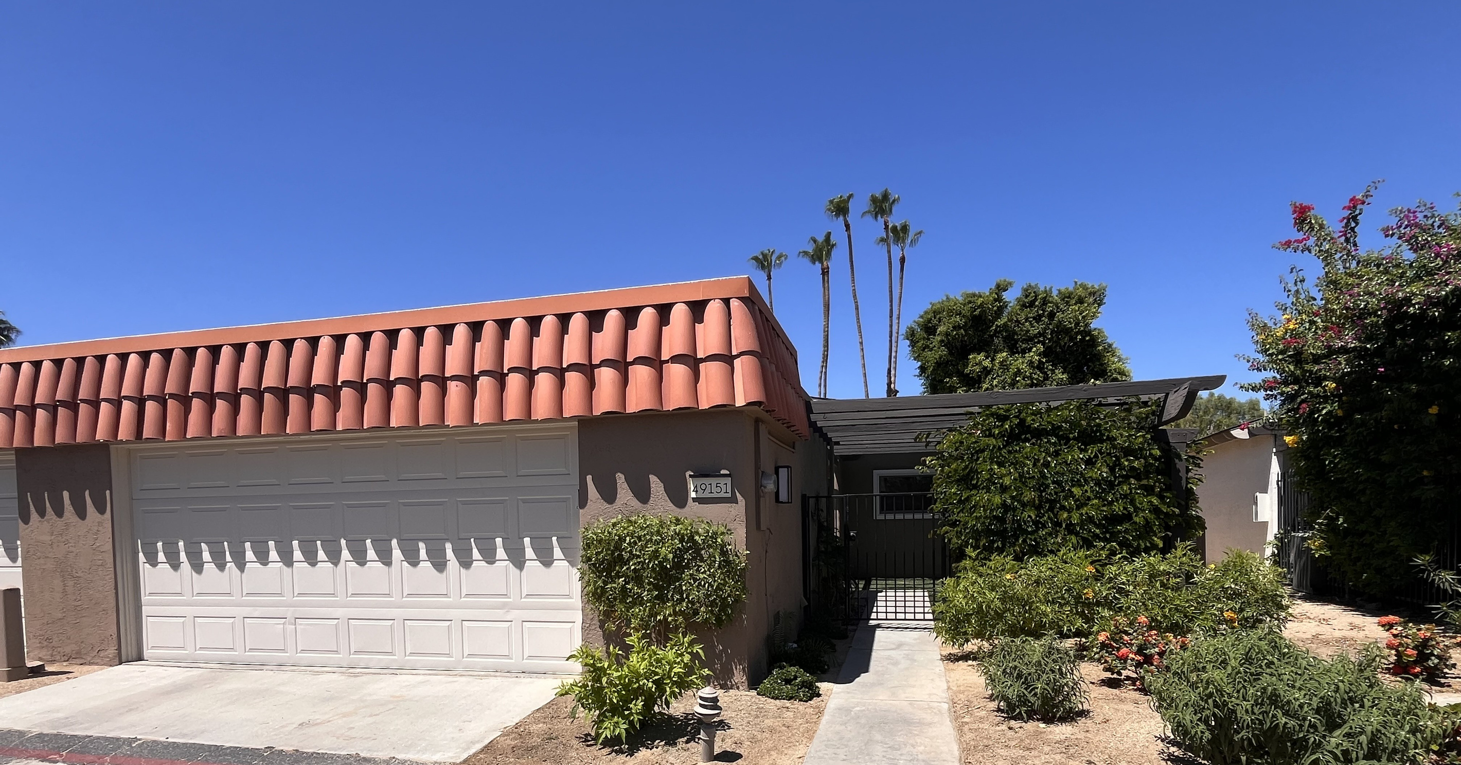 Gated front entry to private courtyard, two car garage.