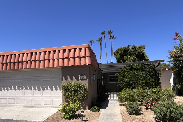 Gated front entry to private courtyard, two car garage.