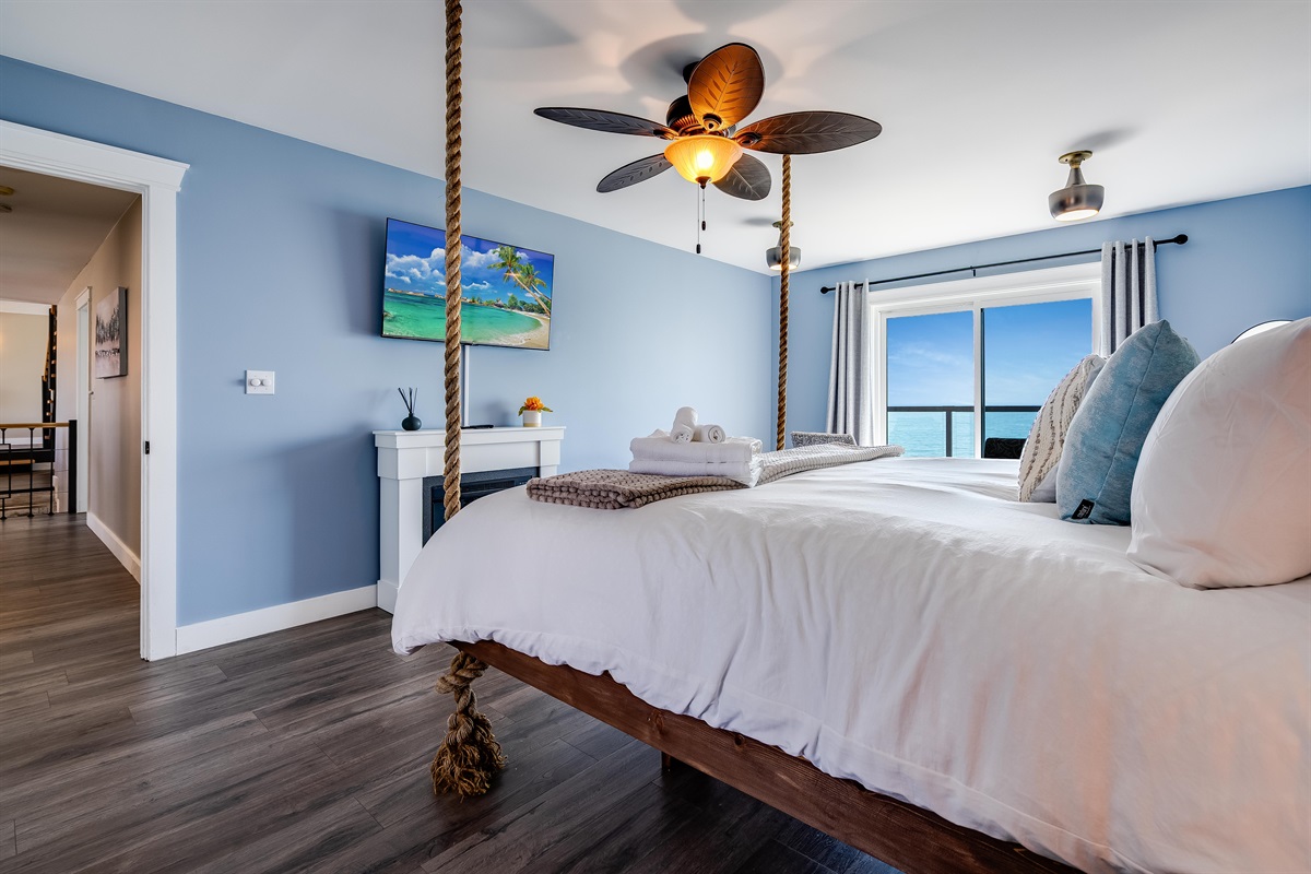 Master Bedroom with King bed and access to second story balcony with calming lake views