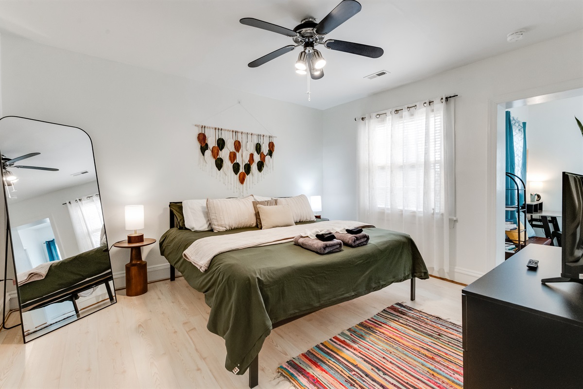 Bedroom Delight: Stylish room with vibrant decor and natural light for your restful getaway!