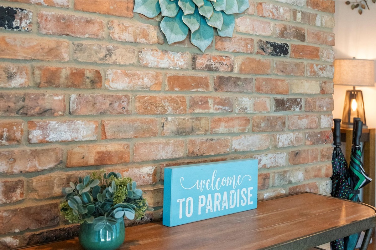 This warm welcome greets you as you enter the lobby front door—'Welcome to Paradise!' Your home away from home awaits, offering comfort, relaxation, and a peaceful retreat.