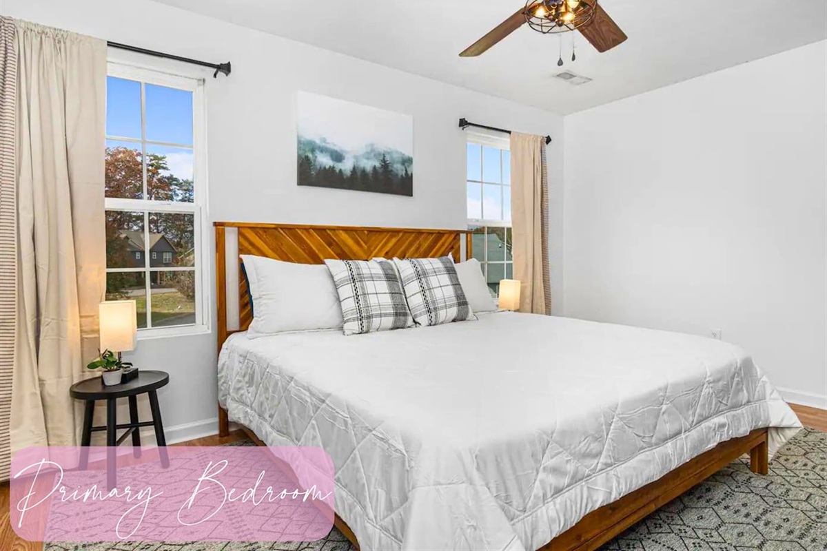 Rest easy in the primary bedroom where simplicity and comfort meet for a peaceful night's sleep.