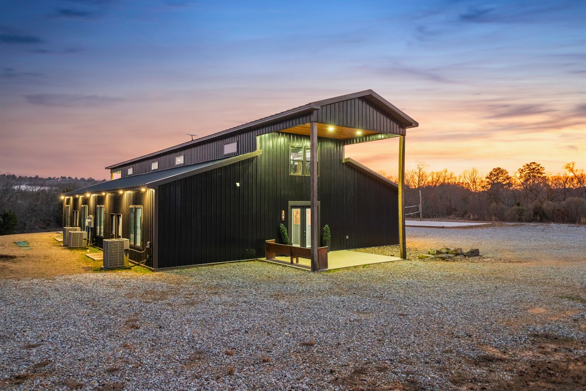 A final evening exterior view wraps it all up, showcasing the beauty of the home and its peaceful surroundings under the fading light.