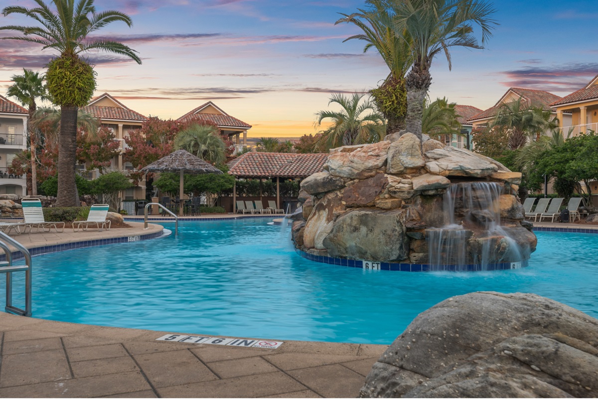 Happy hour at the pool. Sunset, a waterfall, drinks in hand. This is the life.