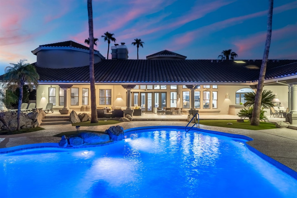 Relax poolside under the Arizona sky surrounded by natural rock features and vibrant landscaping.

