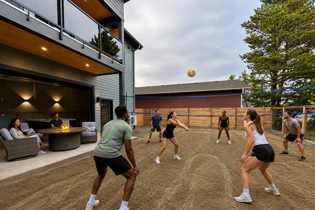 The fully fenced backyard includes a volleyball court, gas fire pit, and cozy seating under the open sky.  The other half has a firepit, adirondack seating, a second hot tub and cornhole for the ultimate experience. 