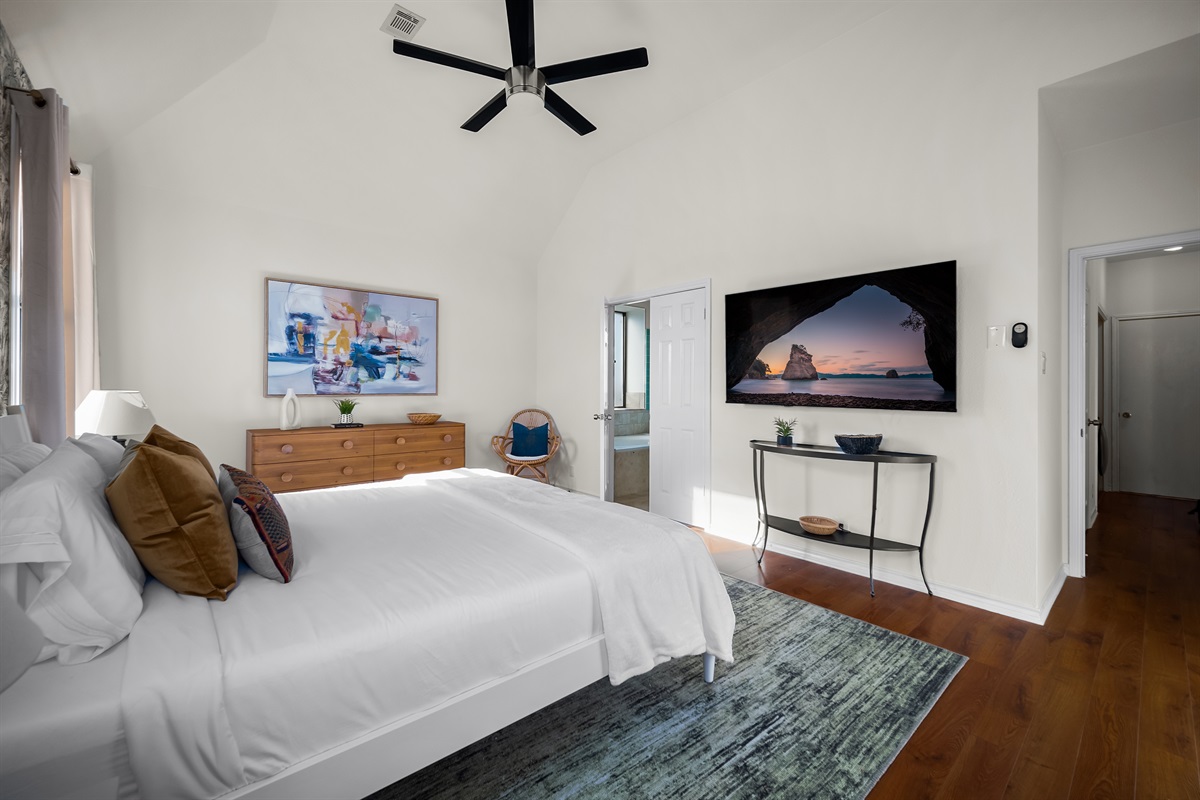 Unwind with a king-sized bed and a 50-inch 4K TV in this primary suite.