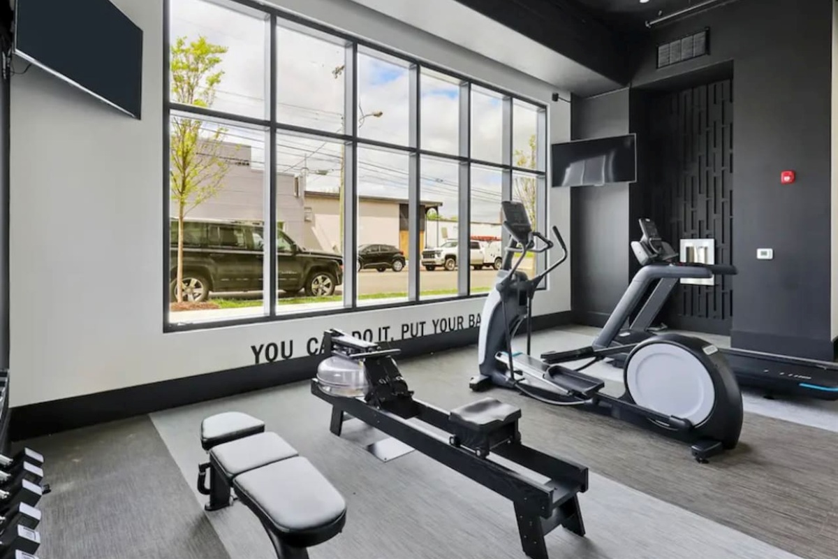 Fitness Room: Bright and airy space to energize your day with modern equipment and inspiring views!
