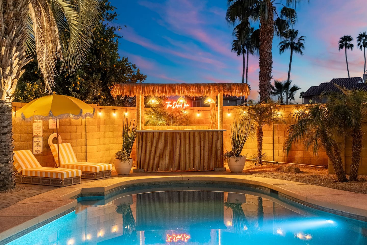 Twilight view of pool and cabana.