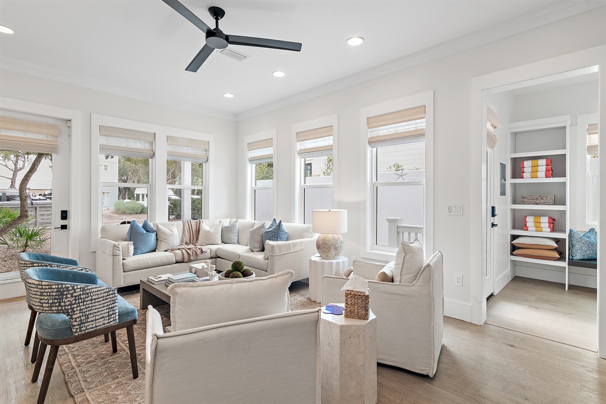 the light filled living room offers abundant space for everyone to relax.