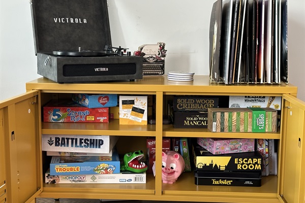 Games conveniently located in TV stand, as well as Victrola and Records to Enjoy!