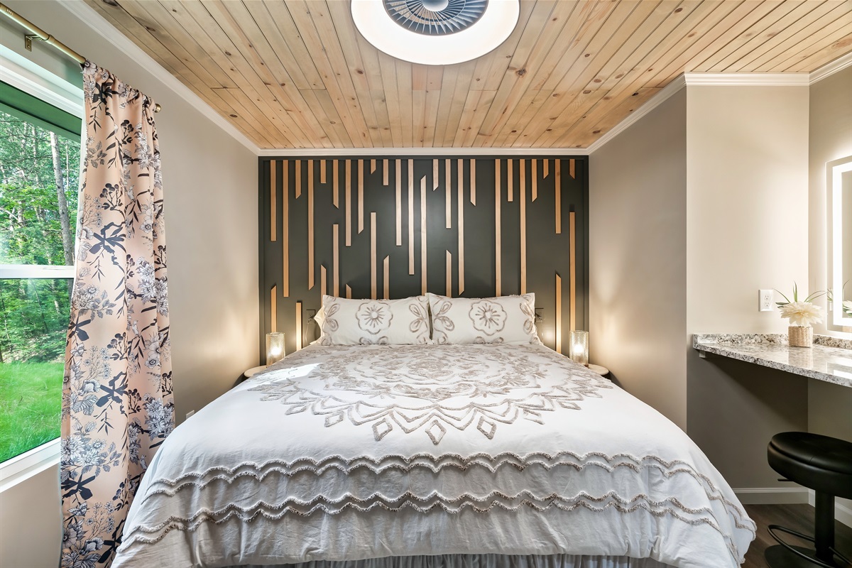 Sleep well surrounded by unique design, a stunning accent wall, and a luxurious duvet.