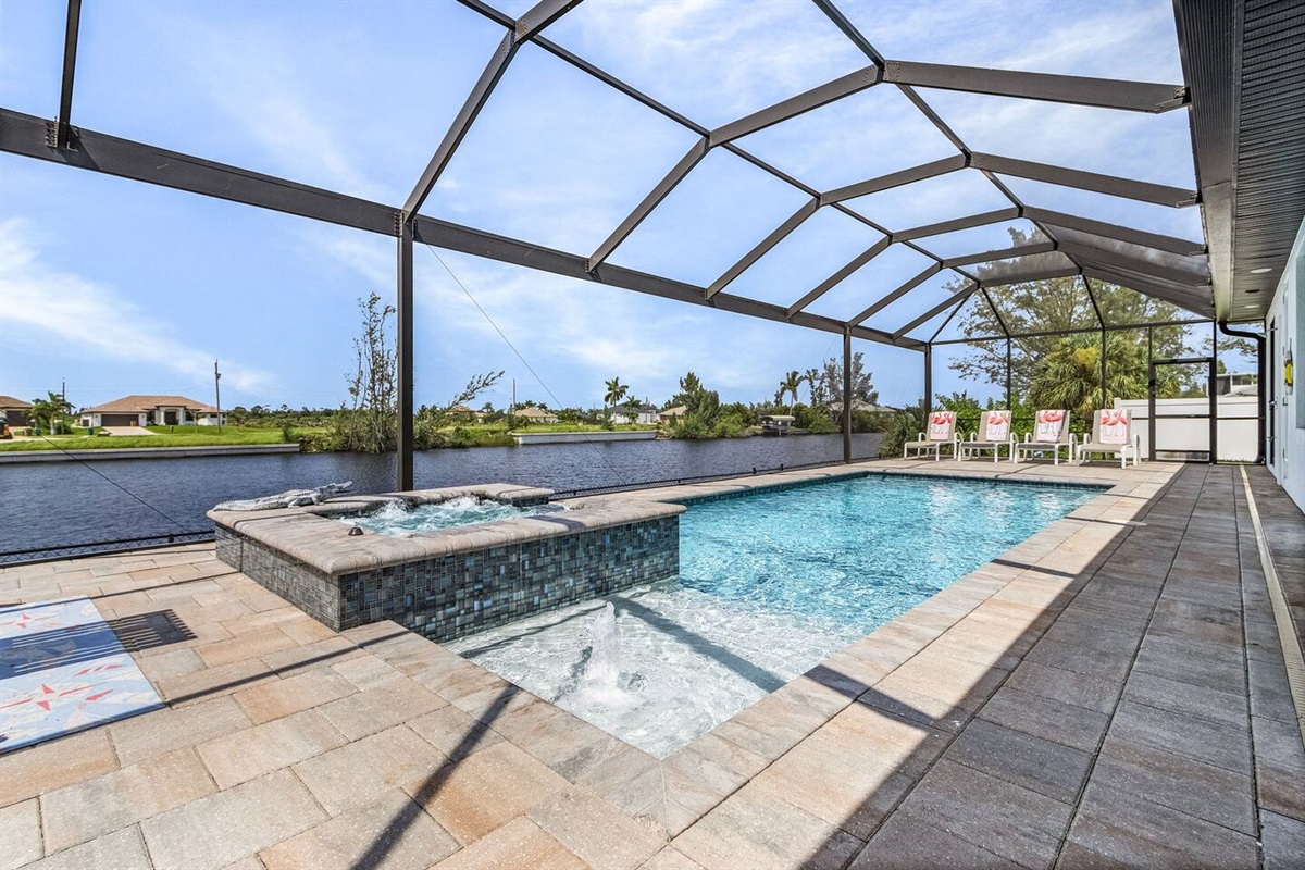Stunning pool and spa area offering amazing water views for a truly exceptional experience!