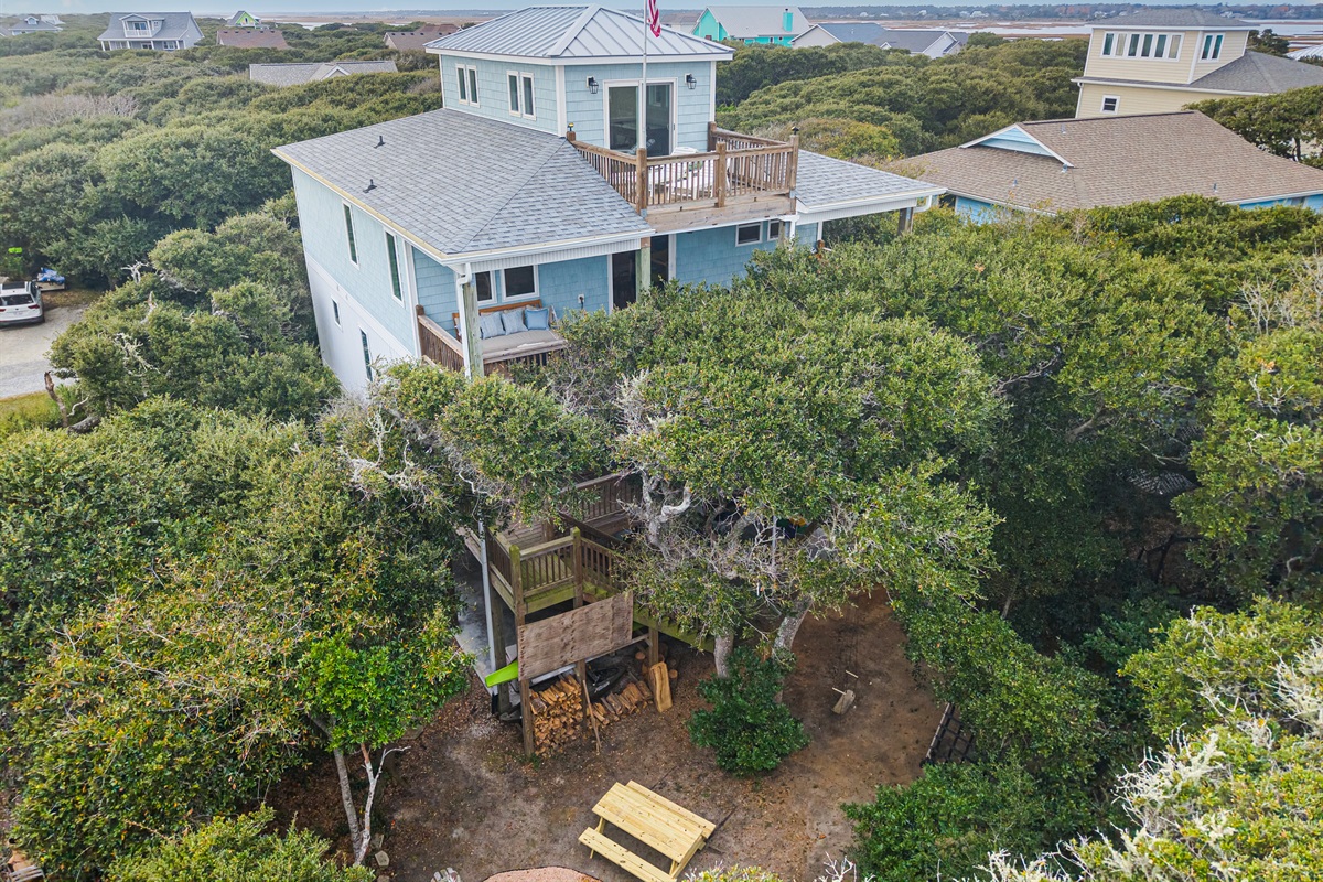 Relax in a serene outdoor haven surrounded by graceful live oaks.