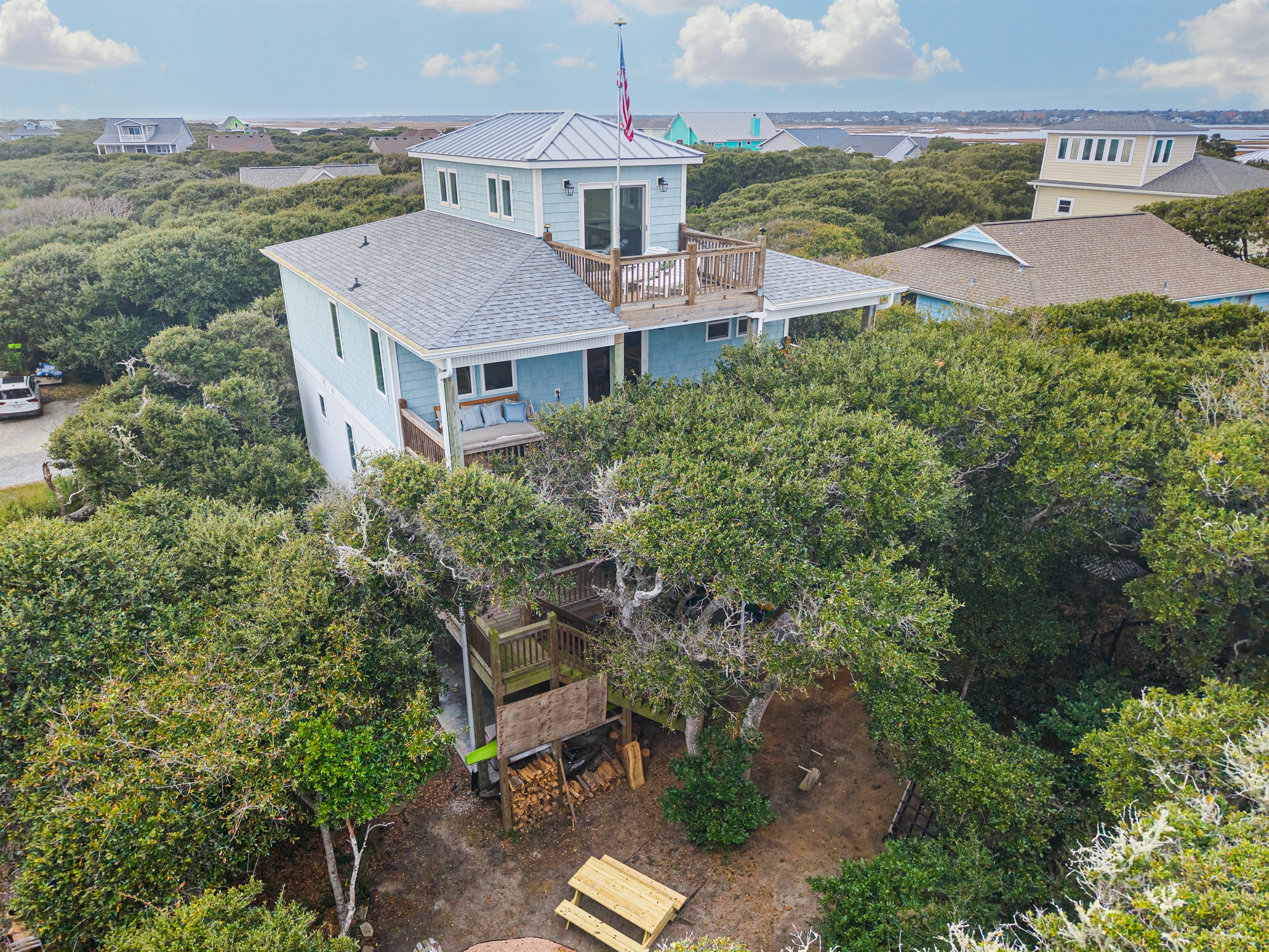 Relax in a serene outdoor haven surrounded by graceful live oaks.