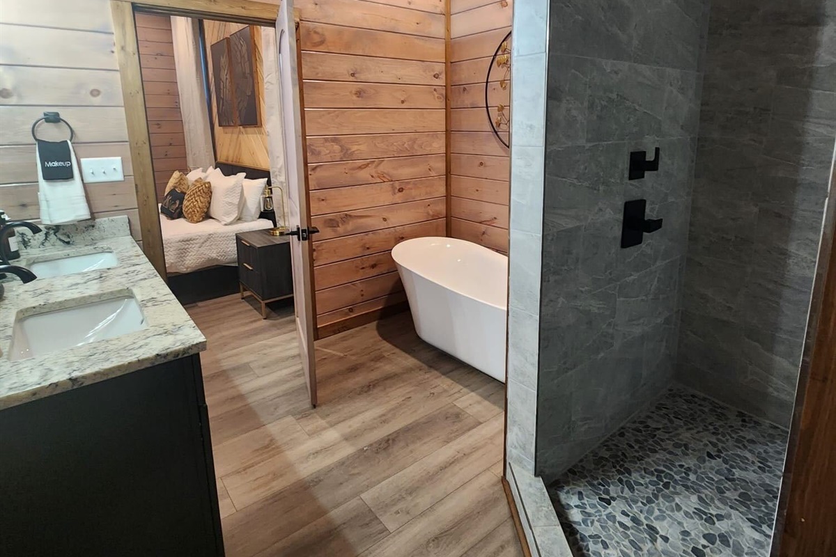 Stunning bathroom with double vanity, soaking tub, and luxury finishes.