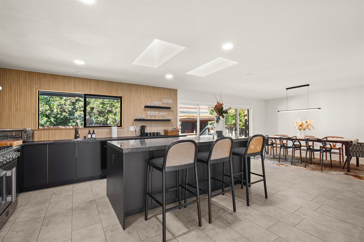 Fully equipped and thoughtfully designed, the kitchen features modern appliances, generous counter space, and everything needed to prepare meals during your stay.