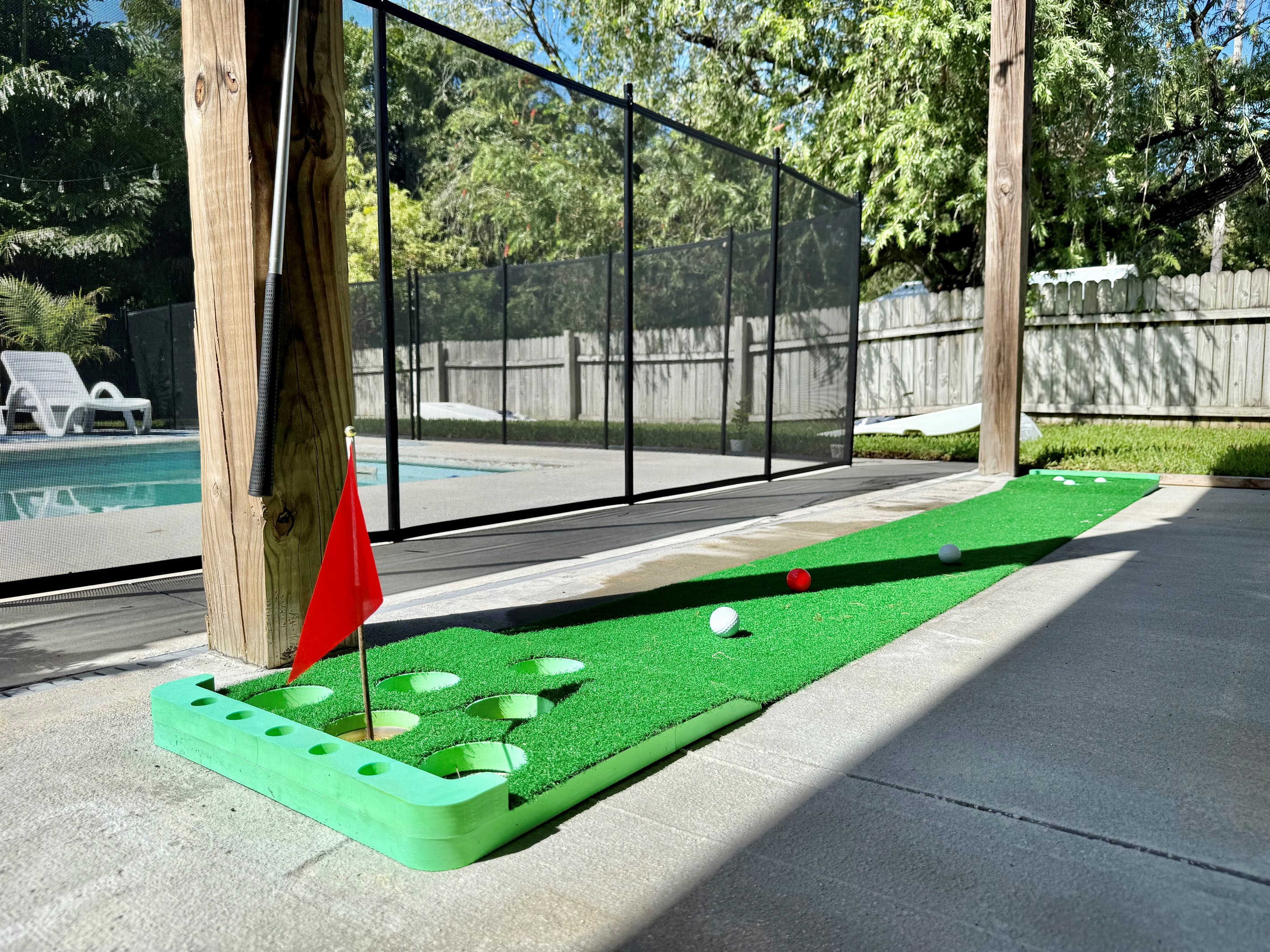 Mini-golf, cornhole, and plenty of space for outdoor play make this yard a hit for all ages.