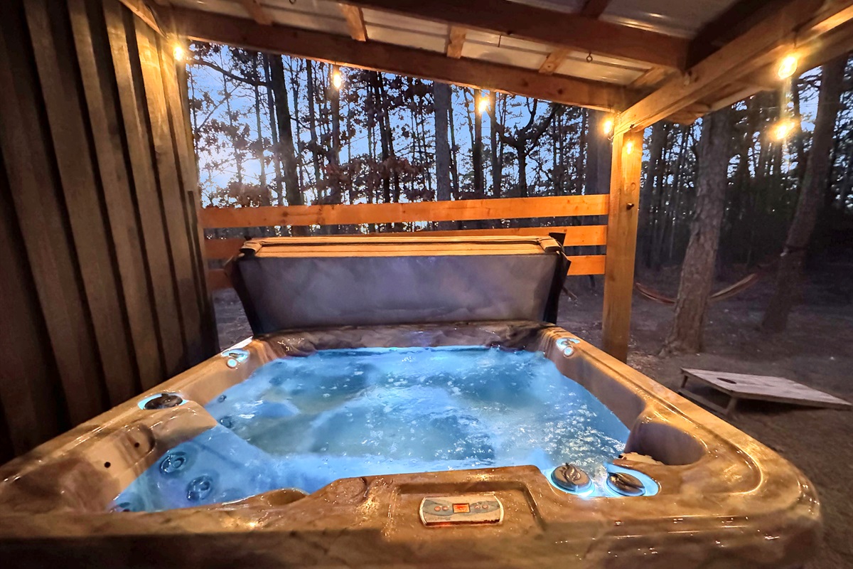 Soak in the hot tub while surrounded by the beauty of Ouachita National Forest.