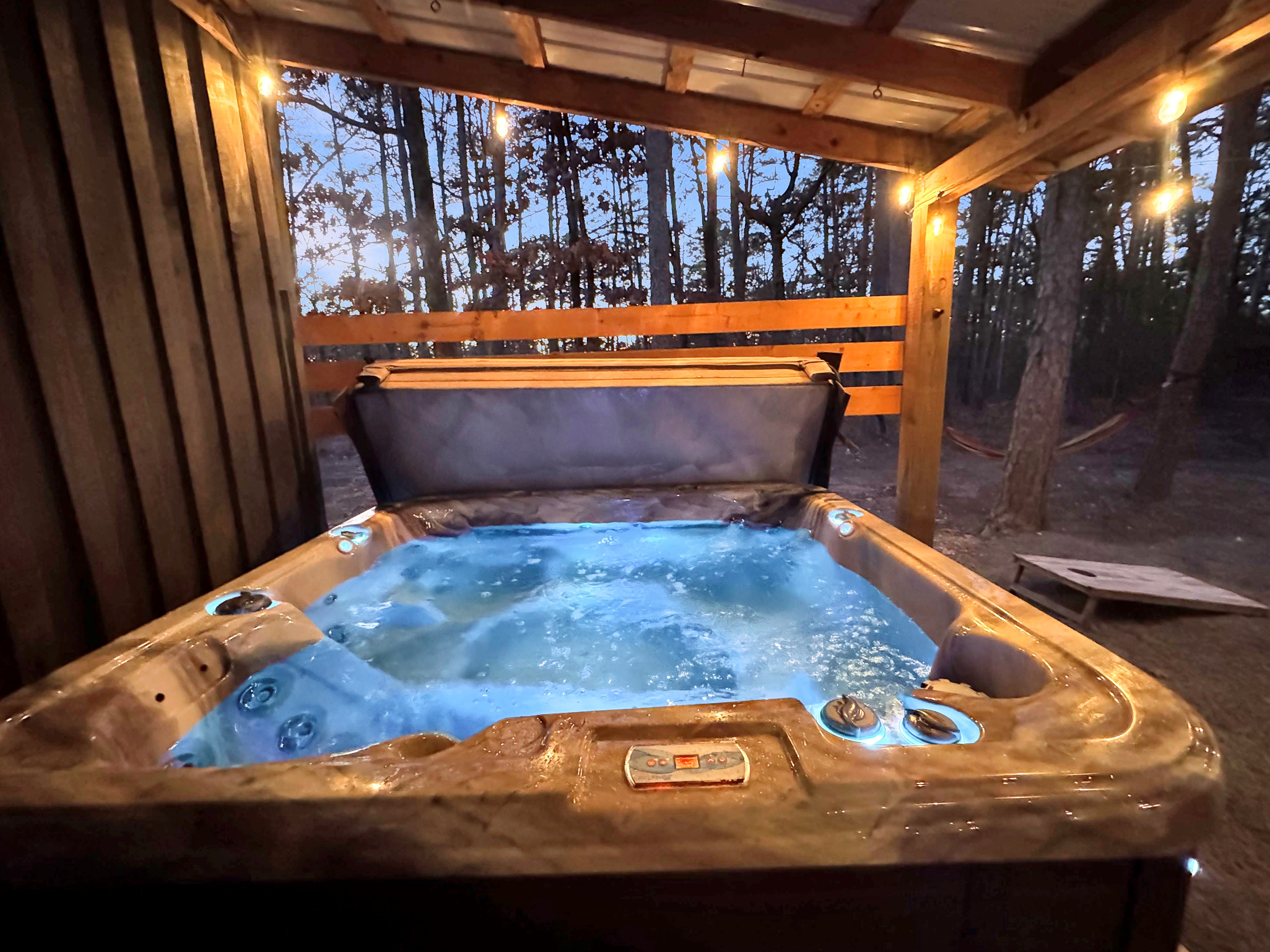Soak in the hot tub while surrounded by the beauty of Ouachita National Forest.