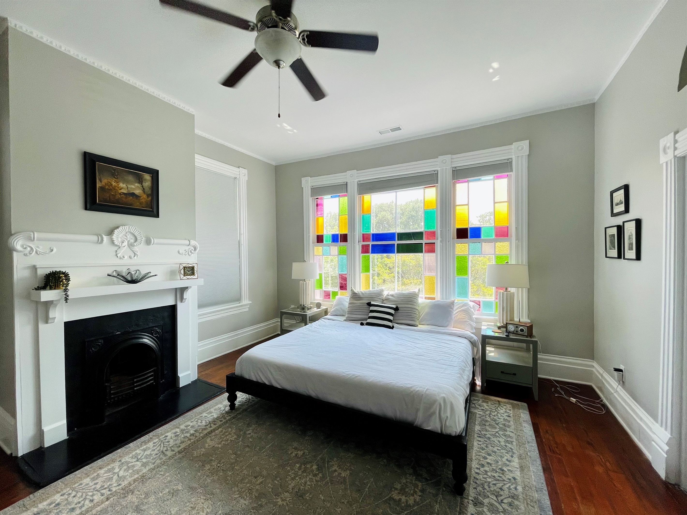 Primary bedroom with ensuite bath is truly a gem.  Stretch out on the king sized bed, enjoying the Savannah sunshine shining through the stain glass windows.  Located on one of the quieter blo