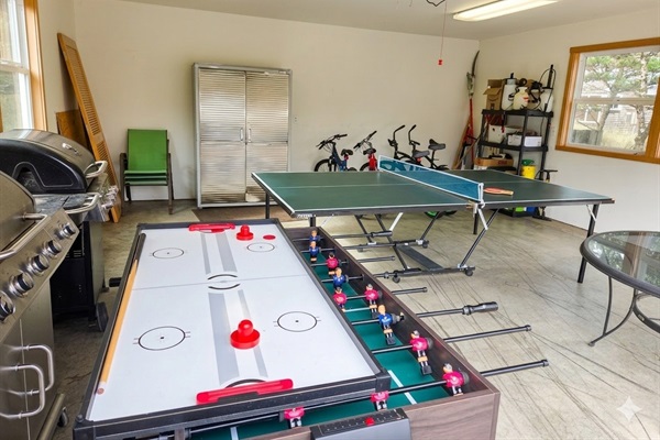 Grab one of the four bikes to ride around, fire up the grill, play some ping pong, air hockey, or foosball!