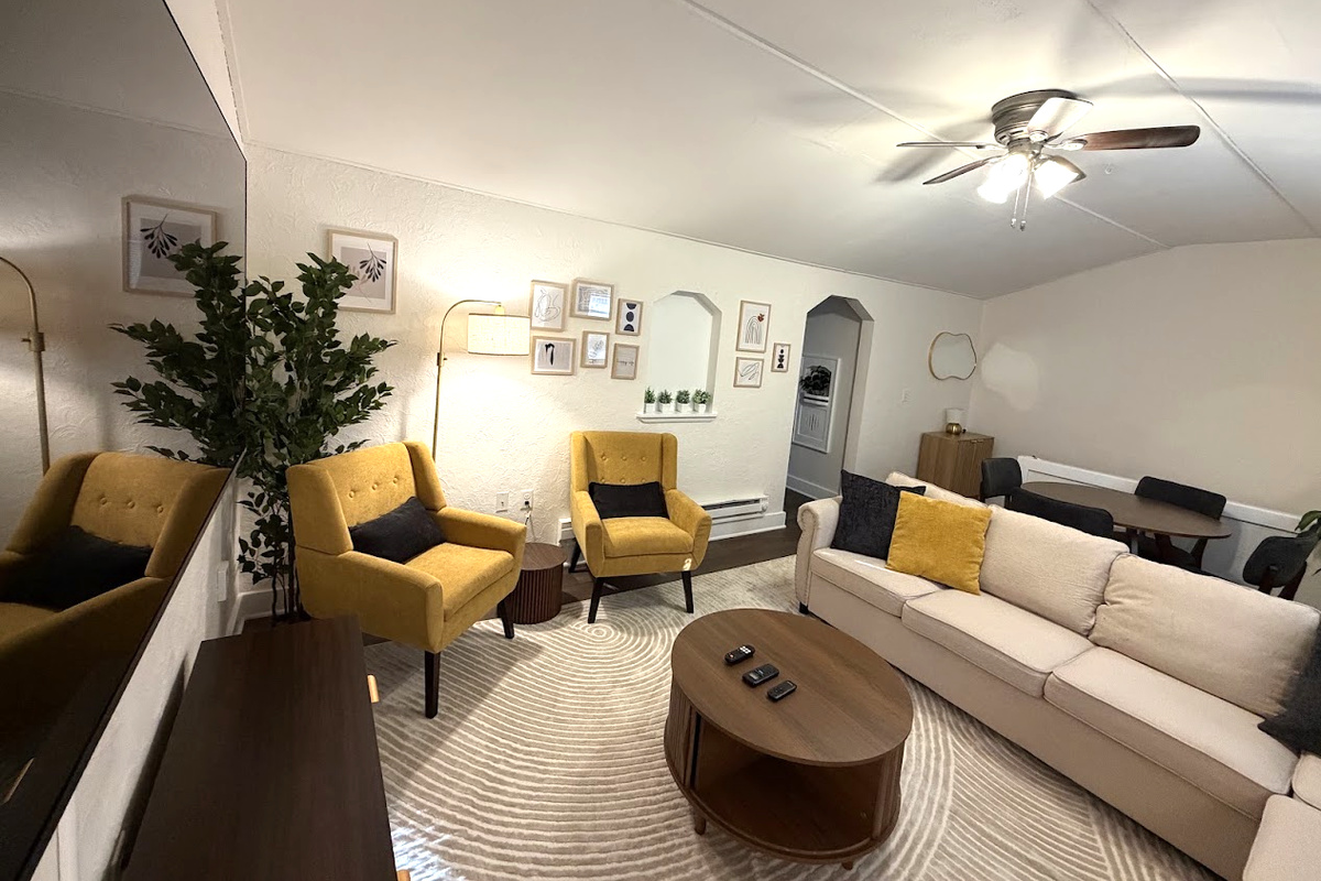 Living Area w/ 65" Smart TV and pull-out sofa bed