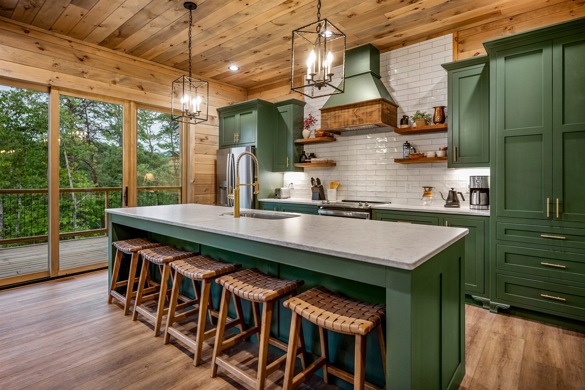 Bold green cabinetry and an amazing view. Forest Ridge Lodge has a fully stocked kitchen