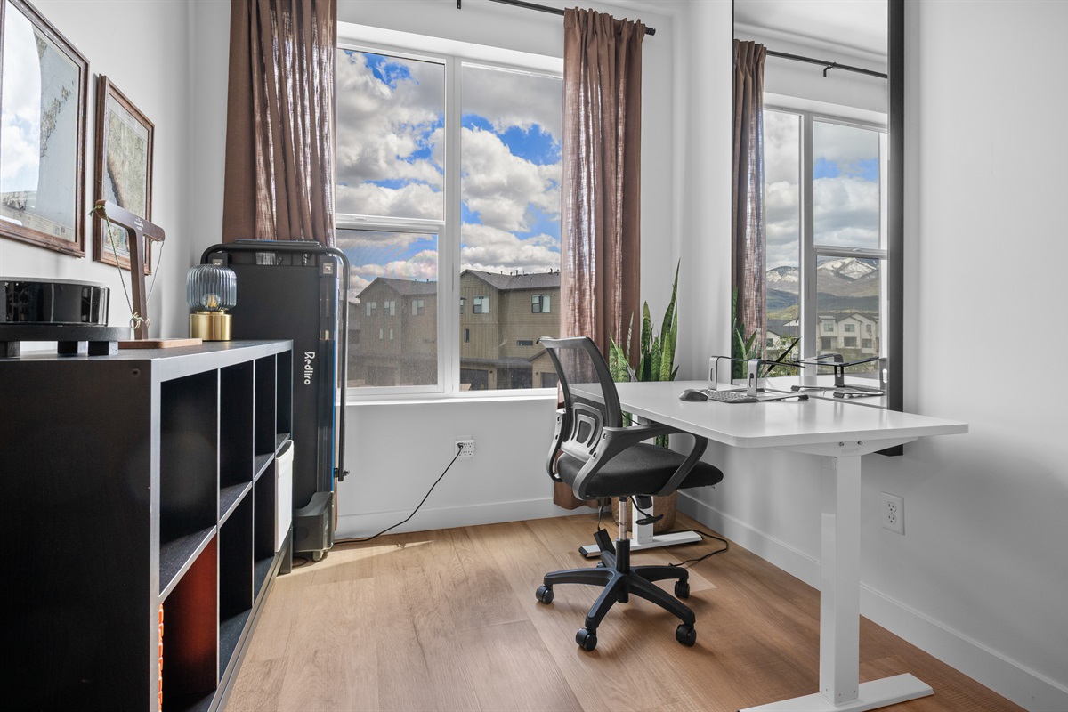 Dedicated workspace with natural light—perfect for remote work or planning adventures.