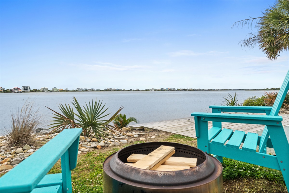 Unwind by the fire while taking in breathtaking panoramic waterfront views