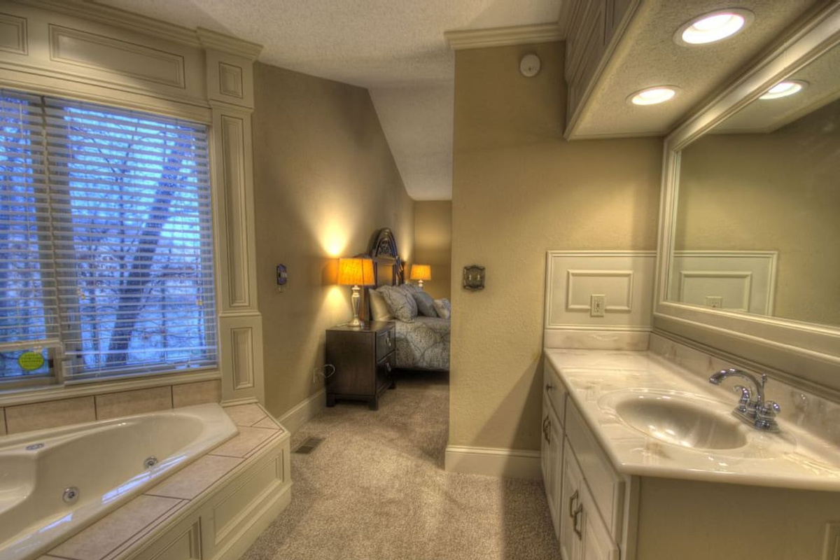 Master bath with lake view Jacuzzi, upper level