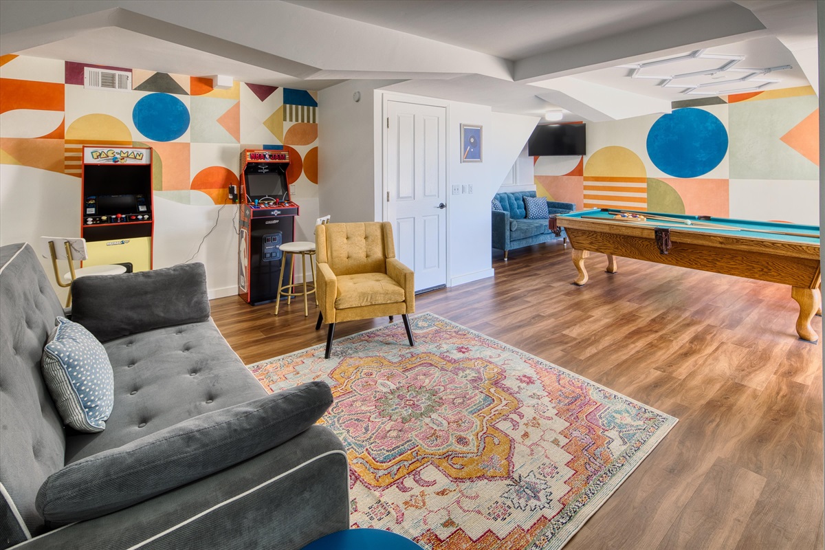 A cozy game room made for late-night laughs, tournament-style pool battles, and hanging out together.