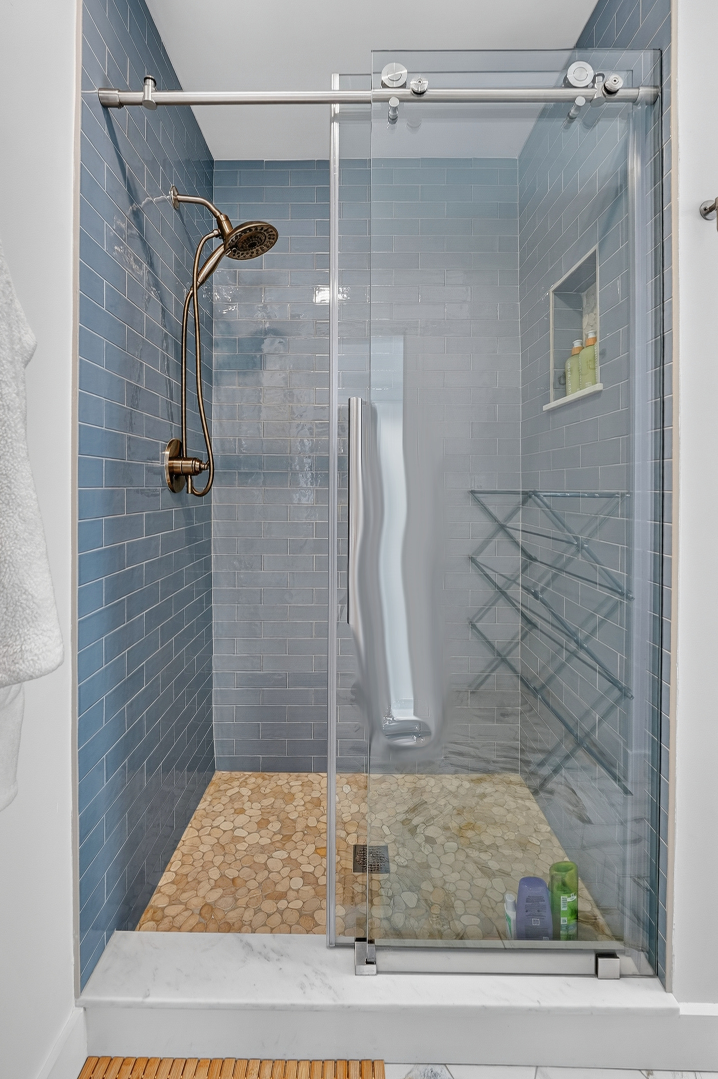 Enjoy a spacious walk-in shower with contemporary design and finishes.