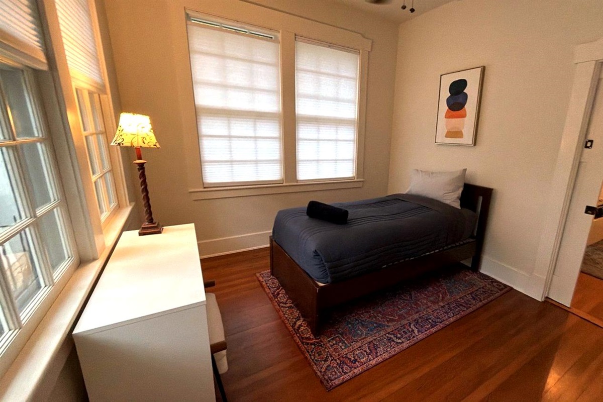 Comfortable single beds in a  cozy bedroom