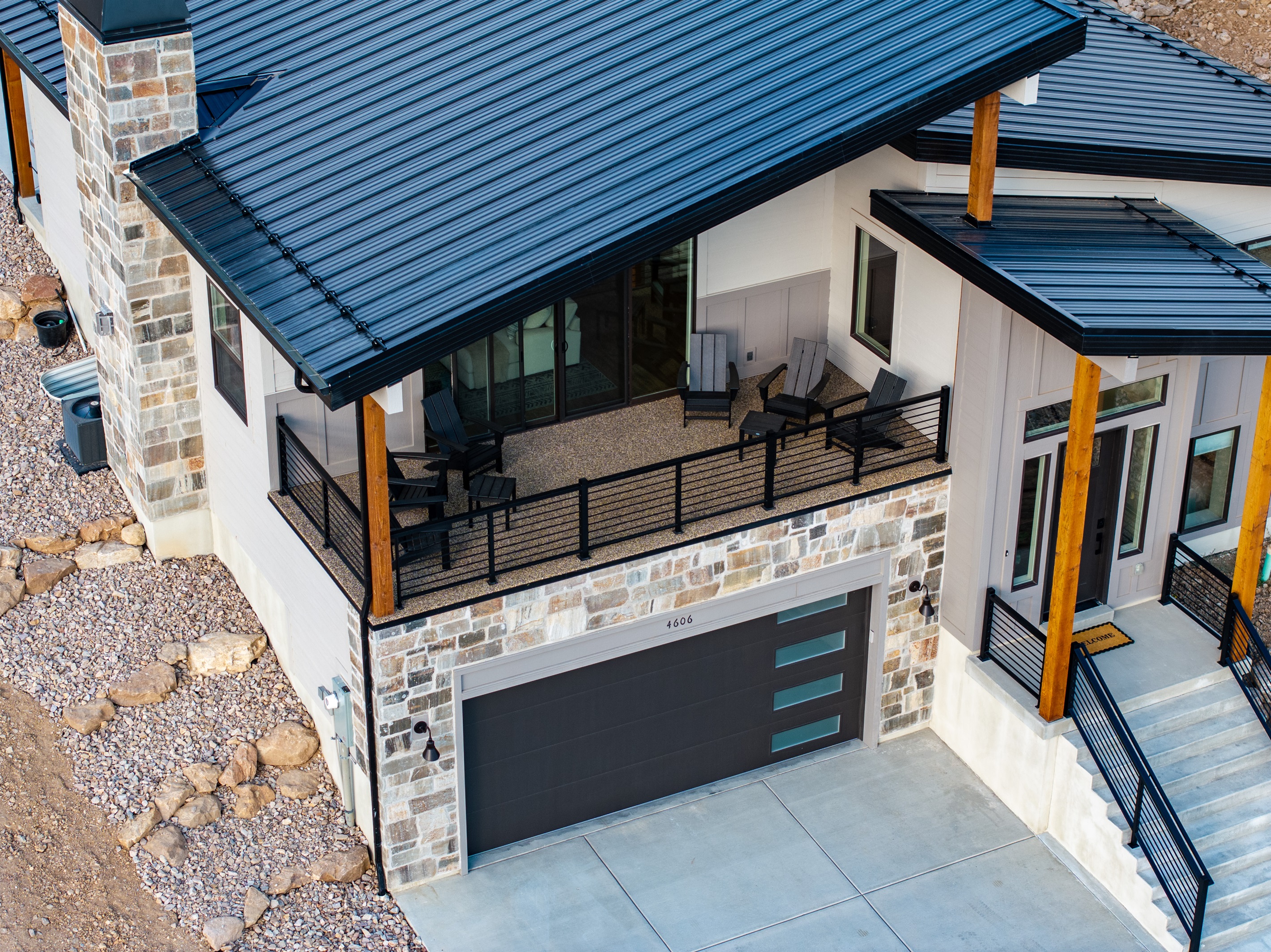 Enjoy fresh mountain air from the covered deck with Adirondack-style seating for six.