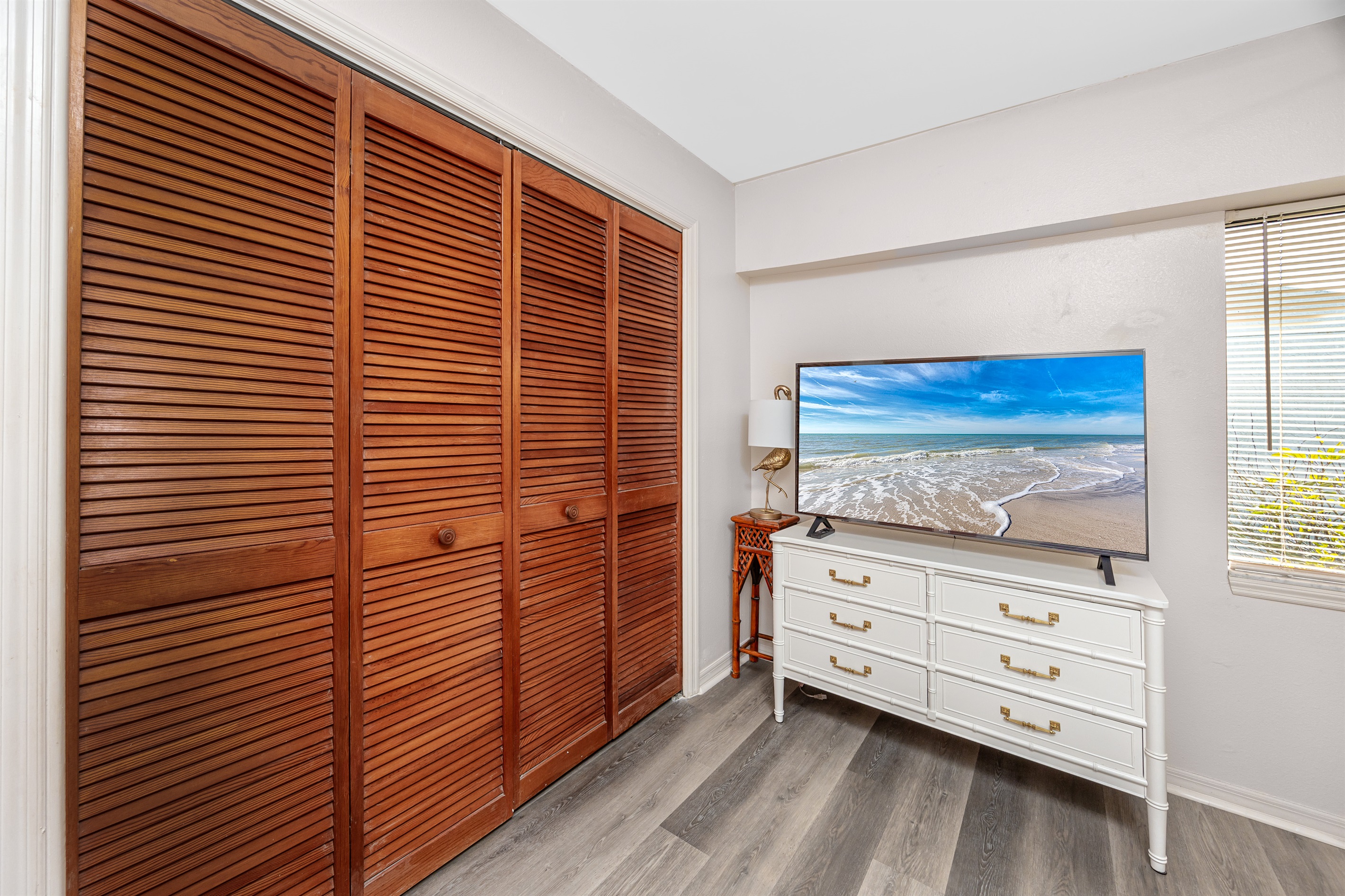 Closet space in Bedroom 2 with a Smart TV